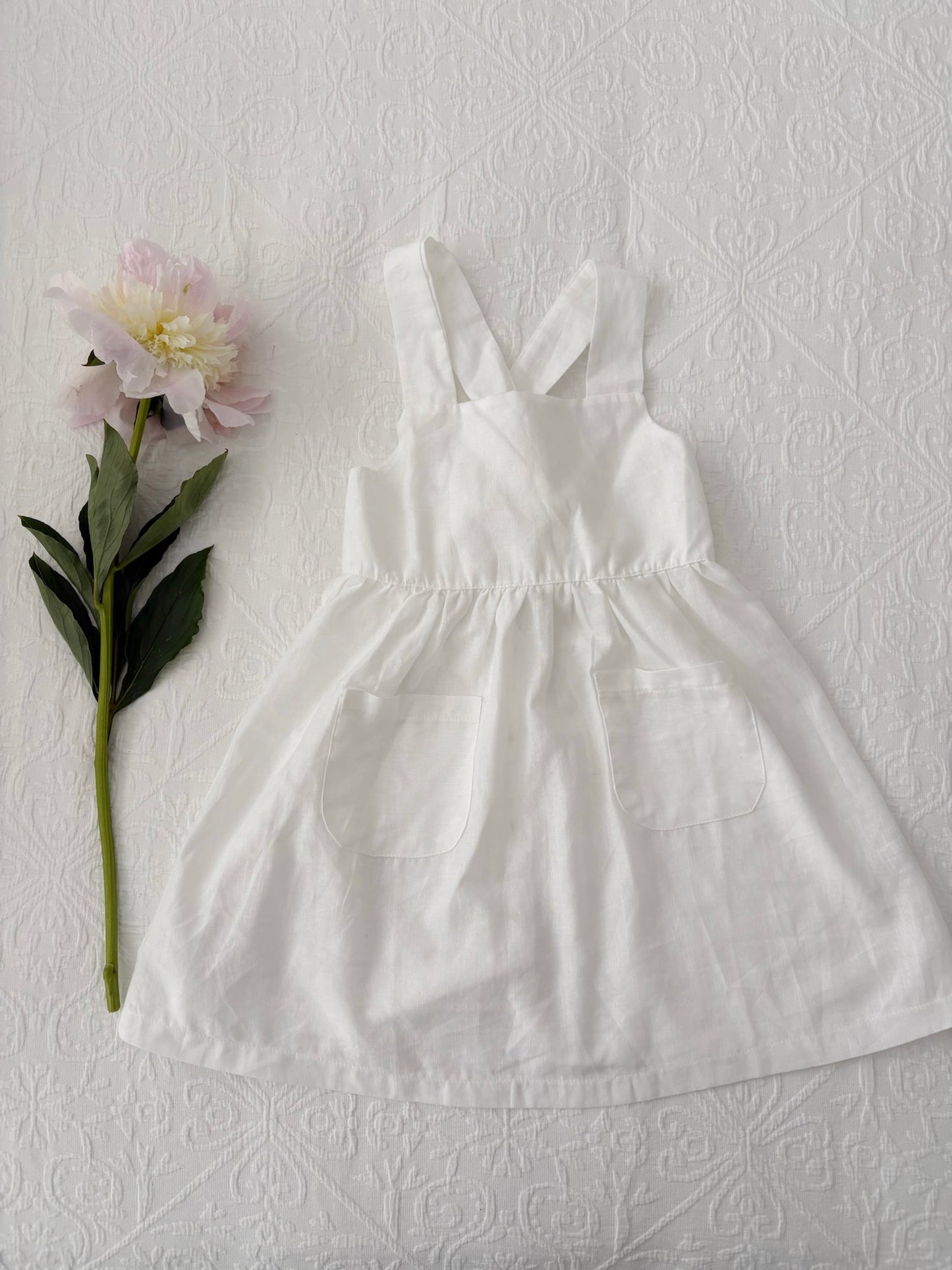 Milky Mae Amelia Dress made with a gentle linen/ cotton blend featuring delicate wooden buttons and an elegant tie bow feature