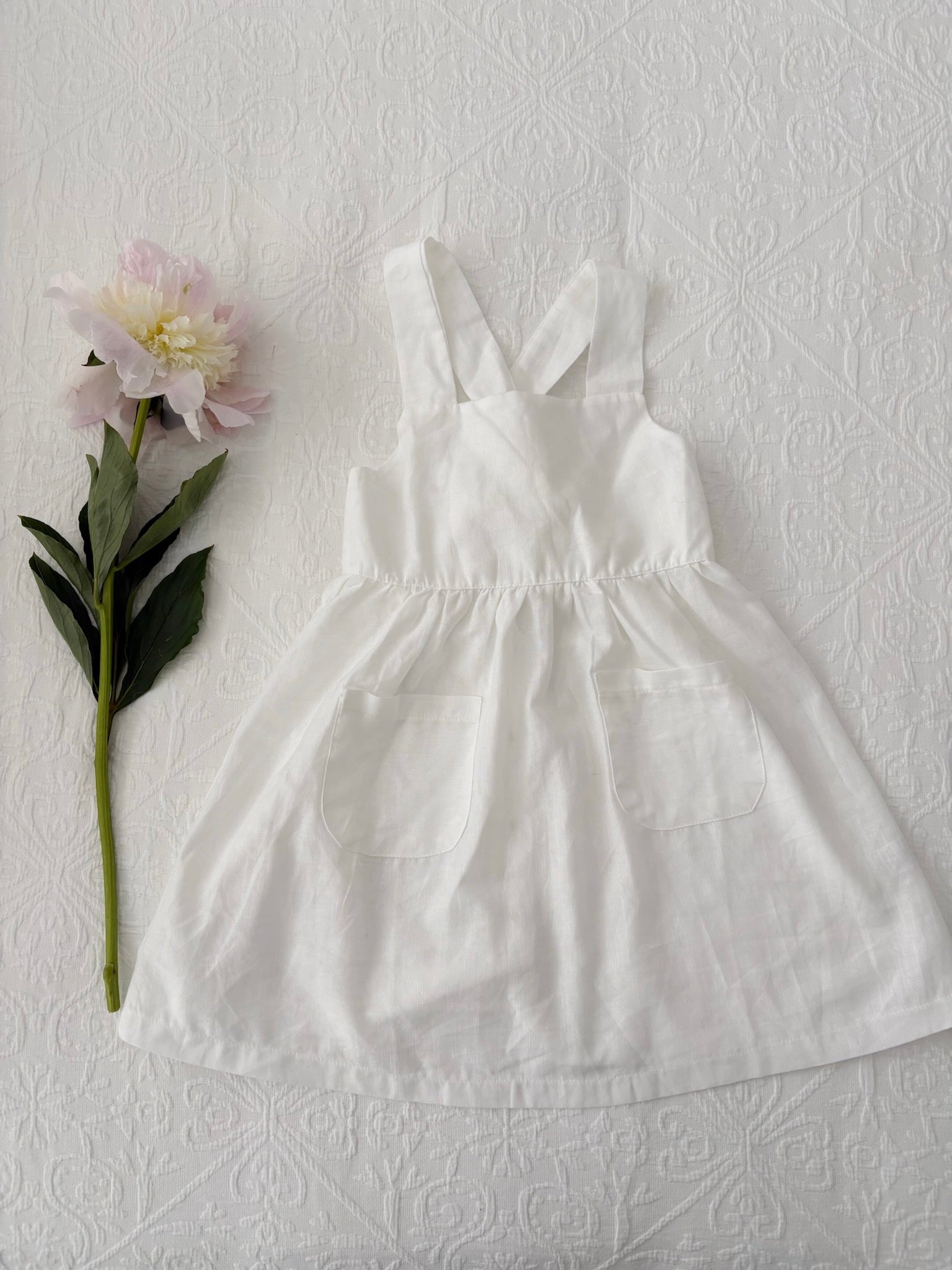 Milky Mae Amelia Dress made with a gentle linen/ cotton blend featuring delicate wooden buttons and an elegant tie bow feature