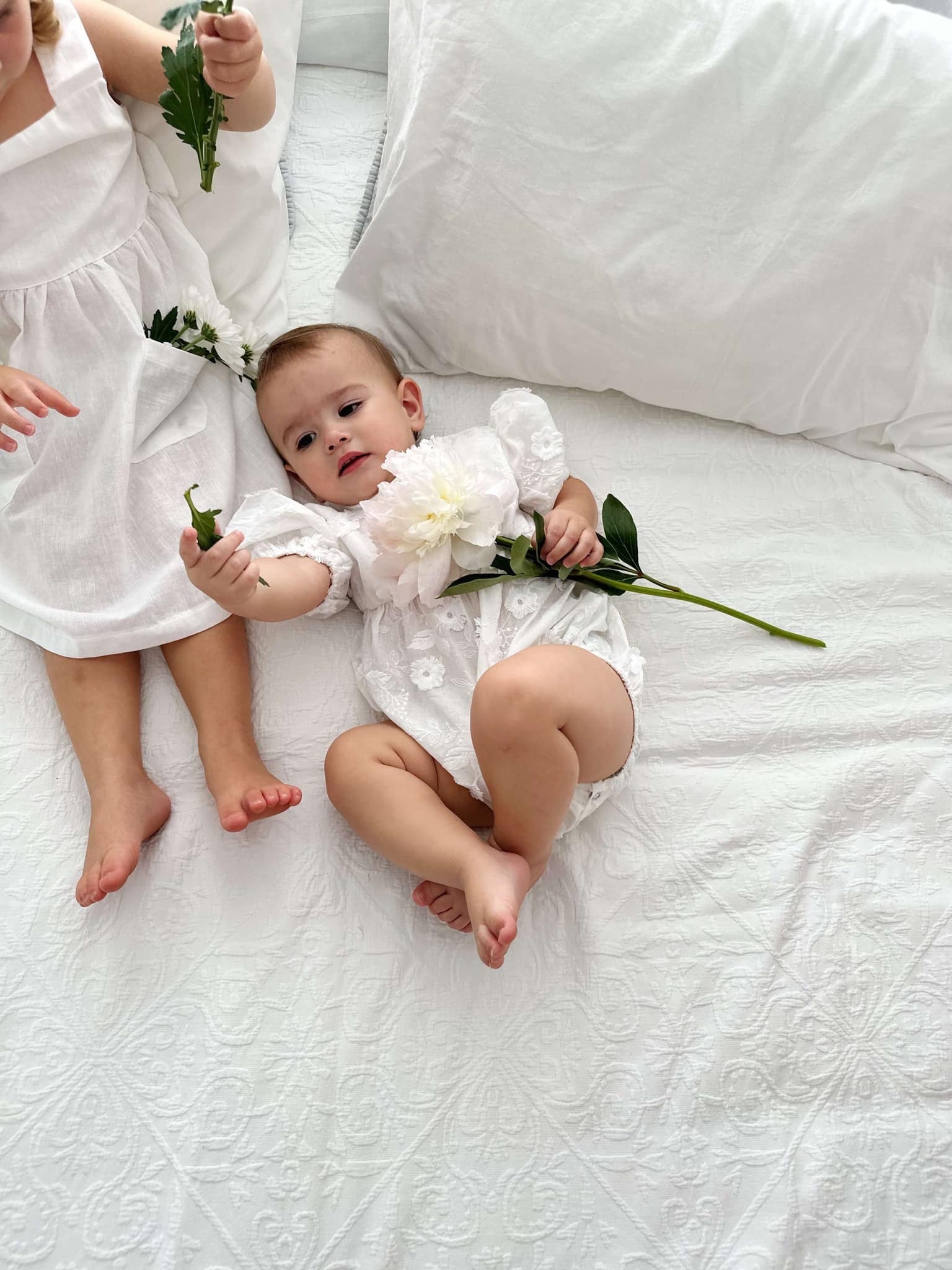 Milky Mae Elaina Romper in cotton fabric with delicate embroidered flowers