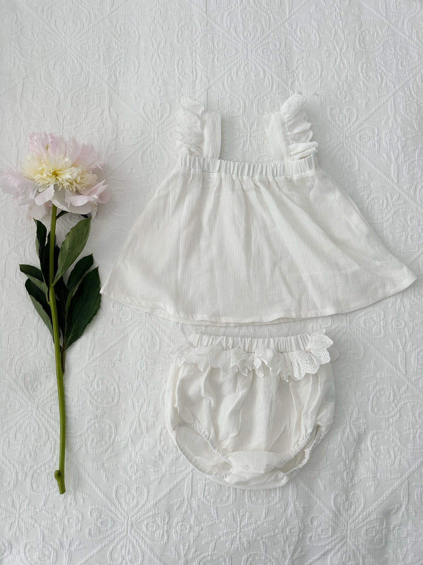 Milky Mae Madeleine Set featuring a soft, flowy white top with flutter lace straps