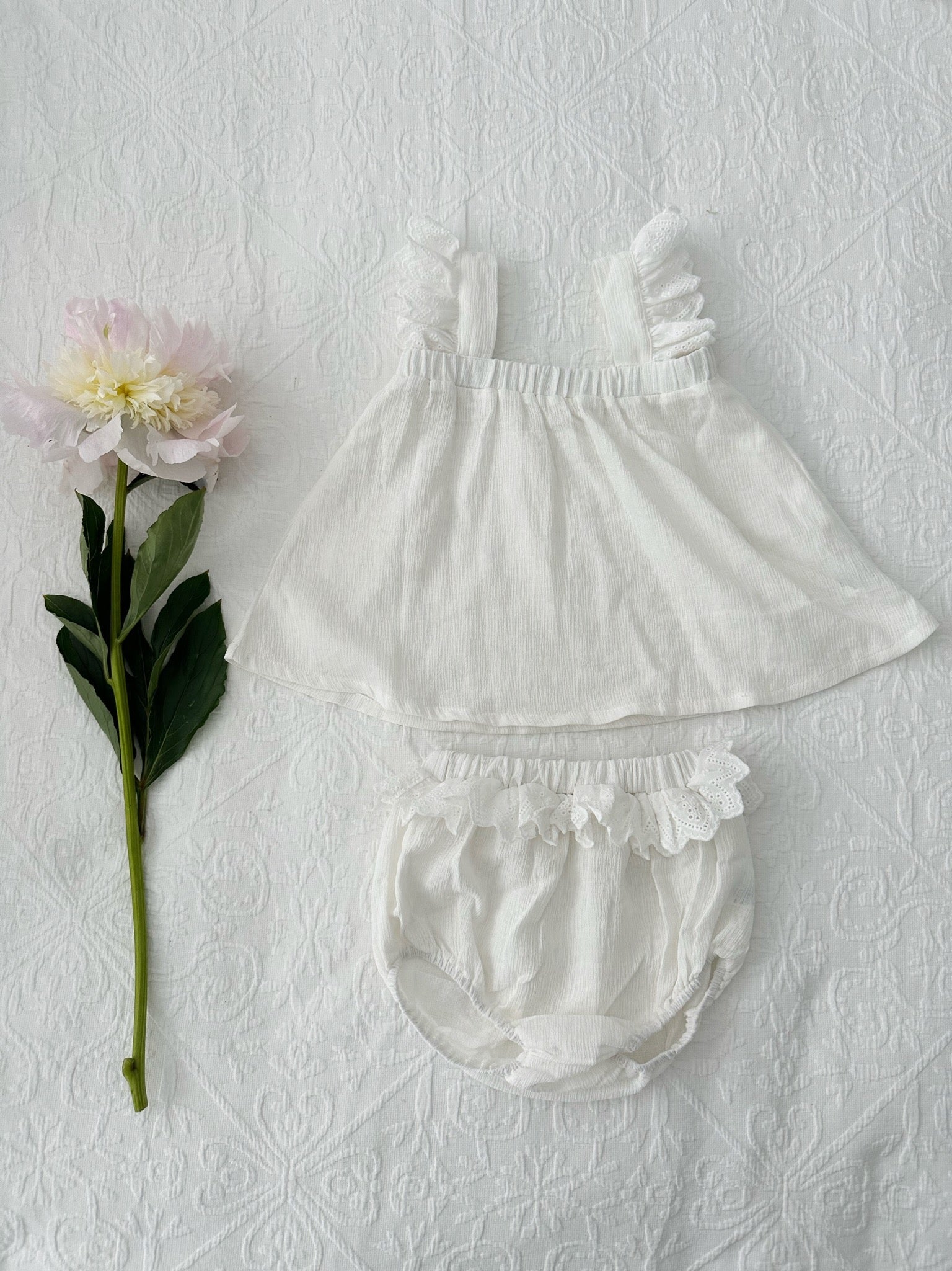 Milky Mae Madeleine Set featuring a soft, flowy white top with flutter lace straps
