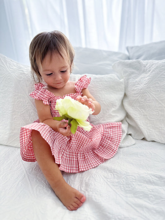 Milky Mae Sweetheart Sundress featuring delicate ruffle straps and a classic pink and white gingham pattern
