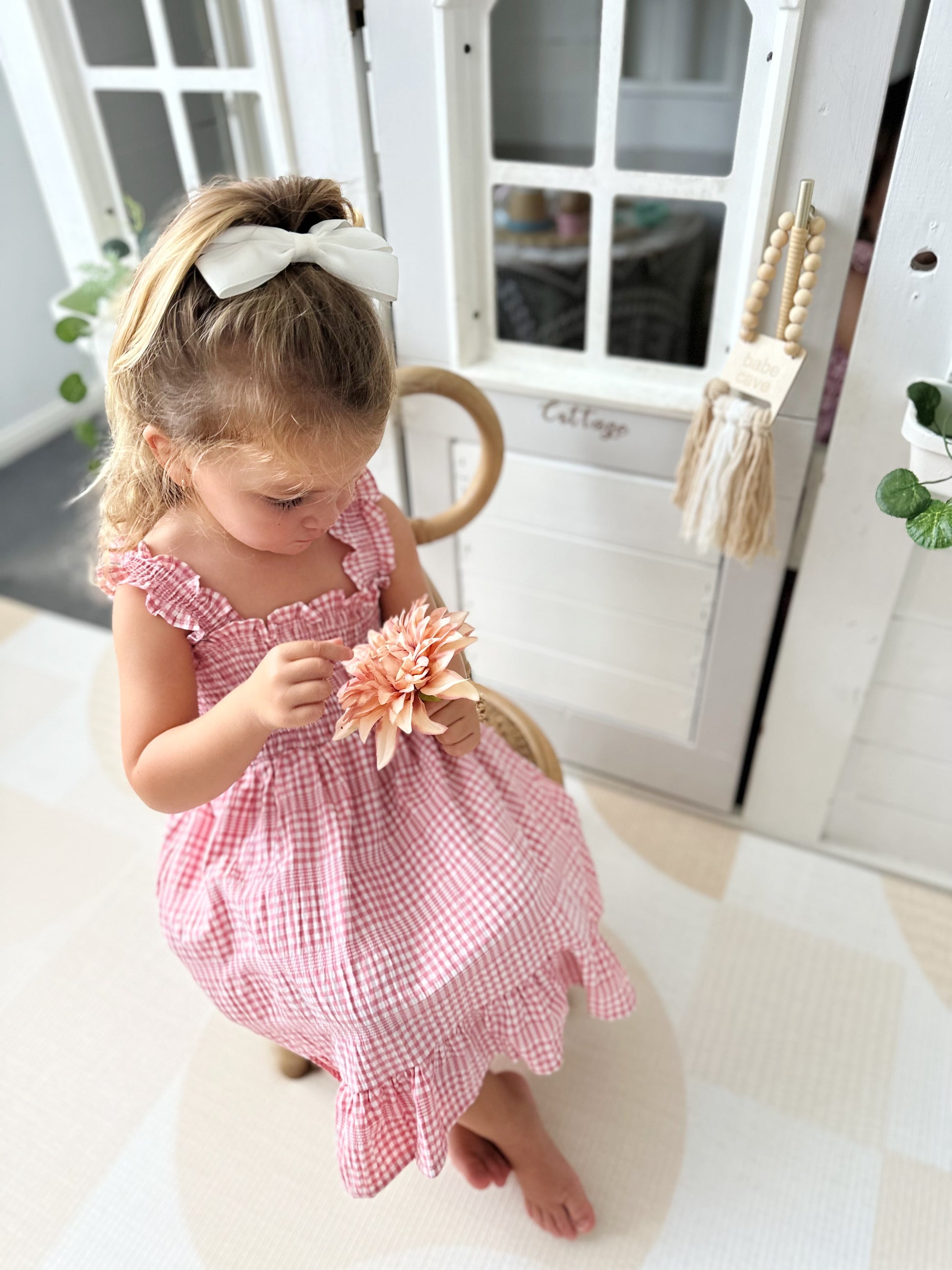 Milky Mae Sweetheart Sundress featuring delicate ruffle straps and a classic pink and white gingham pattern