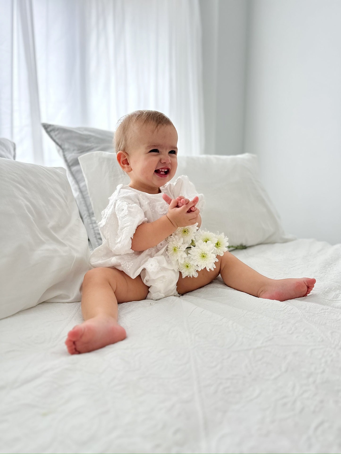 Milky Mae Elaina Romper in cotton fabric with delicate embroidered flowers 