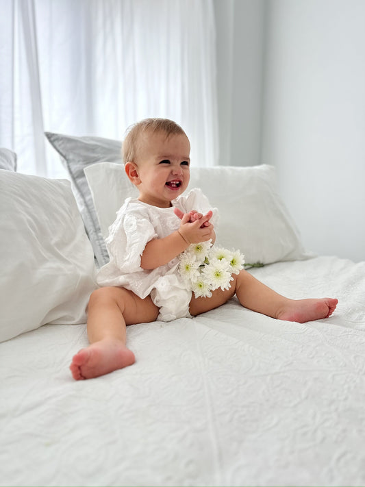 Milky Mae Elaina Romper in cotton fabric with delicate embroidered flowers 